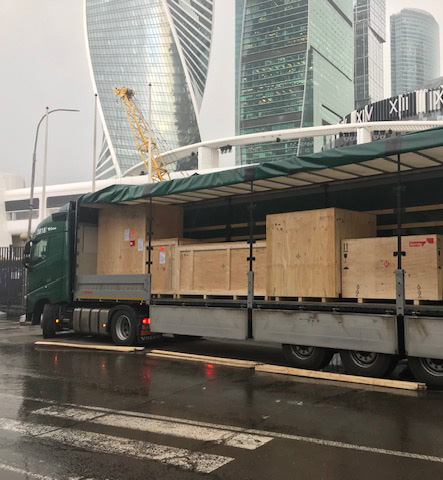 A forklift truck driving event equipment into a truck